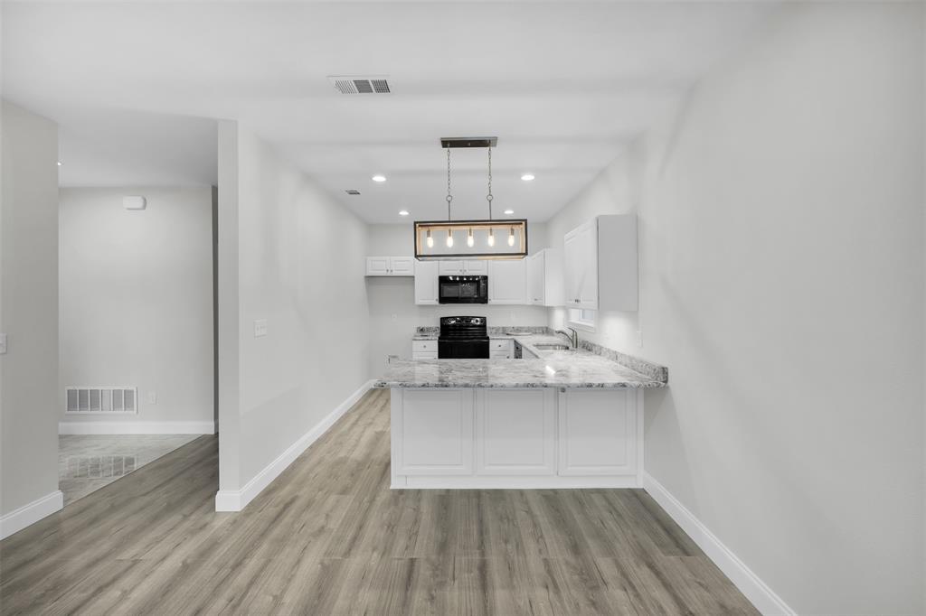 407 Dallas Street Rice, TX 75155 - Photo 8 of 25 a view of kitchen with sink microwave and refrigerator