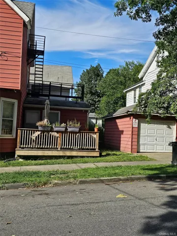 a view of a deck with a yard