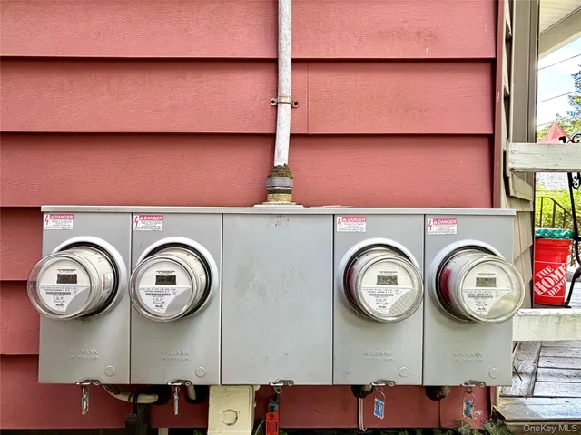 a view of a storage and utility room with racks on the wall