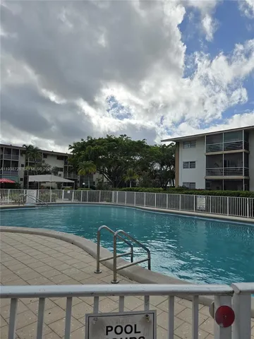 a view of a city with tall trees