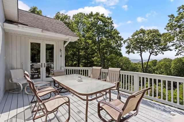 a view of a patio with a table and chairs