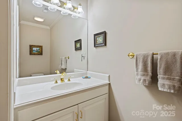 a bathroom with a sink a large mirror and a bathtub