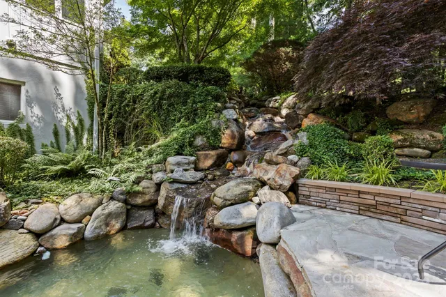 a view of a backyard with sitting area