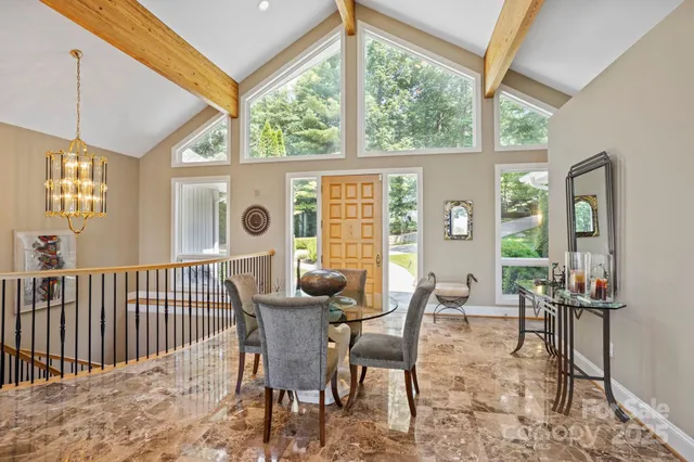 a view of a dining room with furniture window and outside view