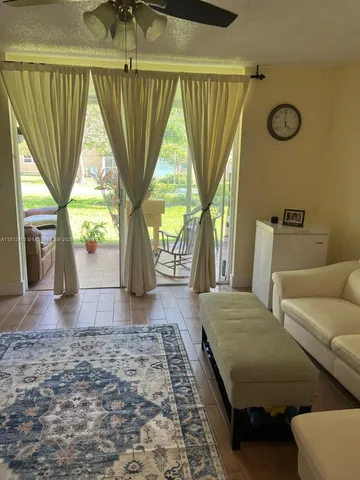 a view of livingroom with furniture and window