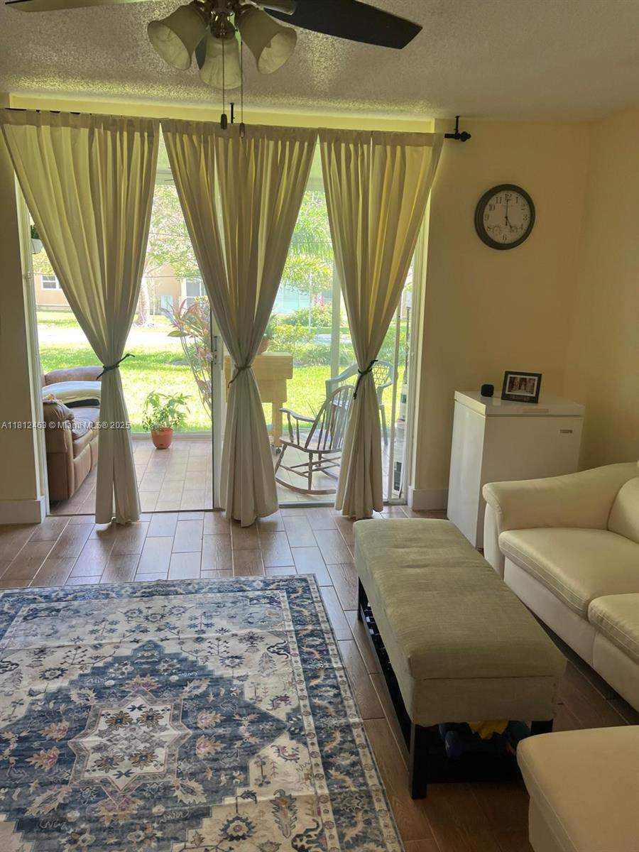 620 Northeast 12th Avenue, Unit 107 Hallandale Beach, FL 33009 - Photo 4 of 16 a view of livingroom with furniture and window