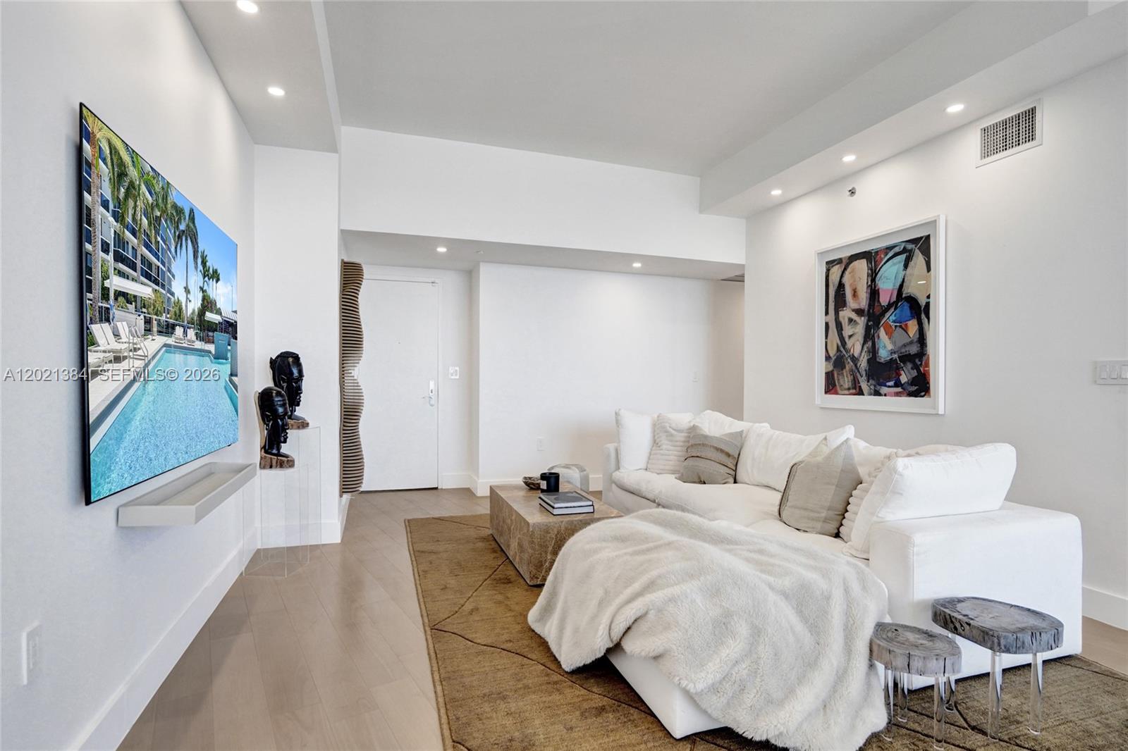 400 Alton Road, Unit PH11 Miami Beach, FL 33139 - Photo 15 of 49 a bed room with a bed and a painting on the wall