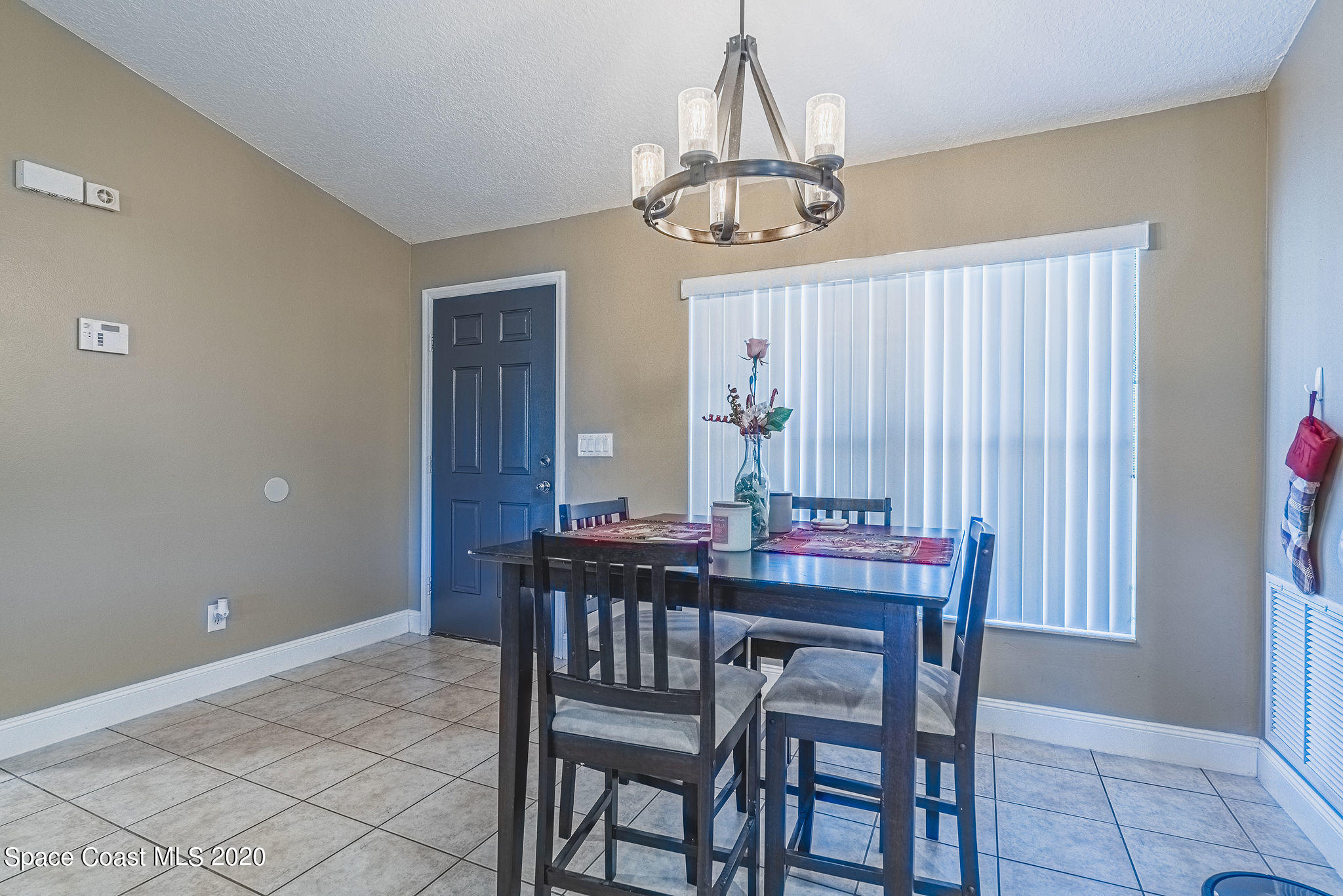 1240 Rabbit Street Southeast Palm Bay, FL 32909 - Photo 2 of 41 a view of a dining room with furniture window and wooden floor