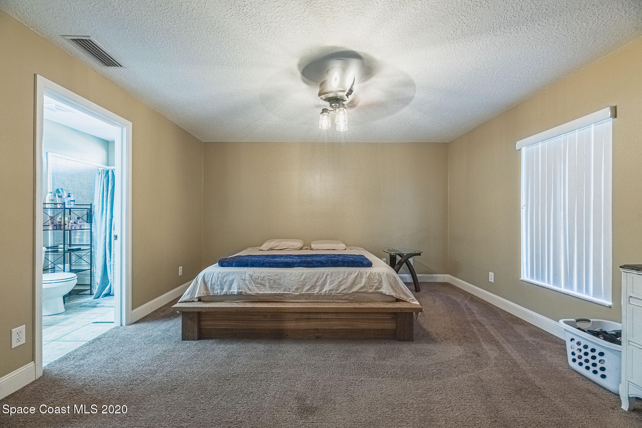1240 Rabbit Street Southeast Palm Bay, FL 32909 - Photo 13 of 41 a car parked in a room