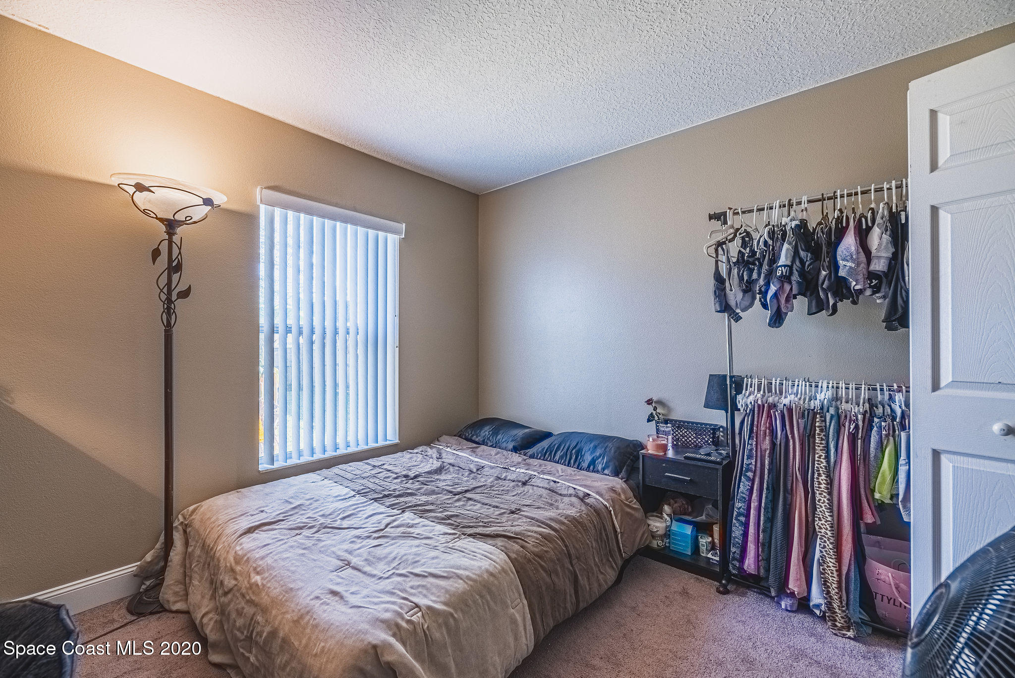 1240 Rabbit Street Southeast Palm Bay, FL 32909 - Photo 18 of 41 a bedroom with a bed and a window