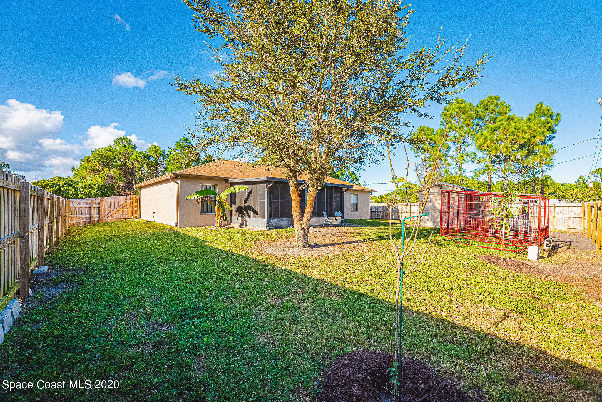 1240 Rabbit Street Southeast Palm Bay, FL 32909 - Photo 21 of 41 a view of a house with swimming pool