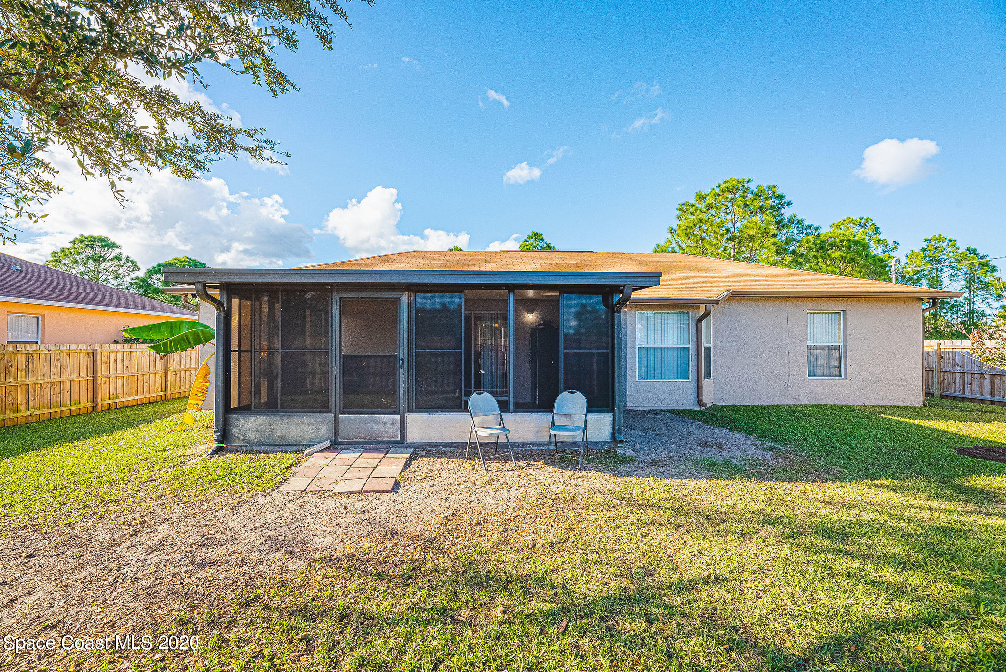 1240 Rabbit Street Southeast Palm Bay, FL 32909 - Photo 23 of 41 a front view of a house with a yard and porch