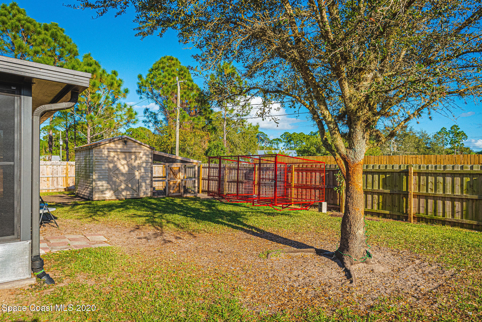 1240 Rabbit Street Southeast Palm Bay, FL 32909 - Photo 24 of 41 a view of a backyard with a tree