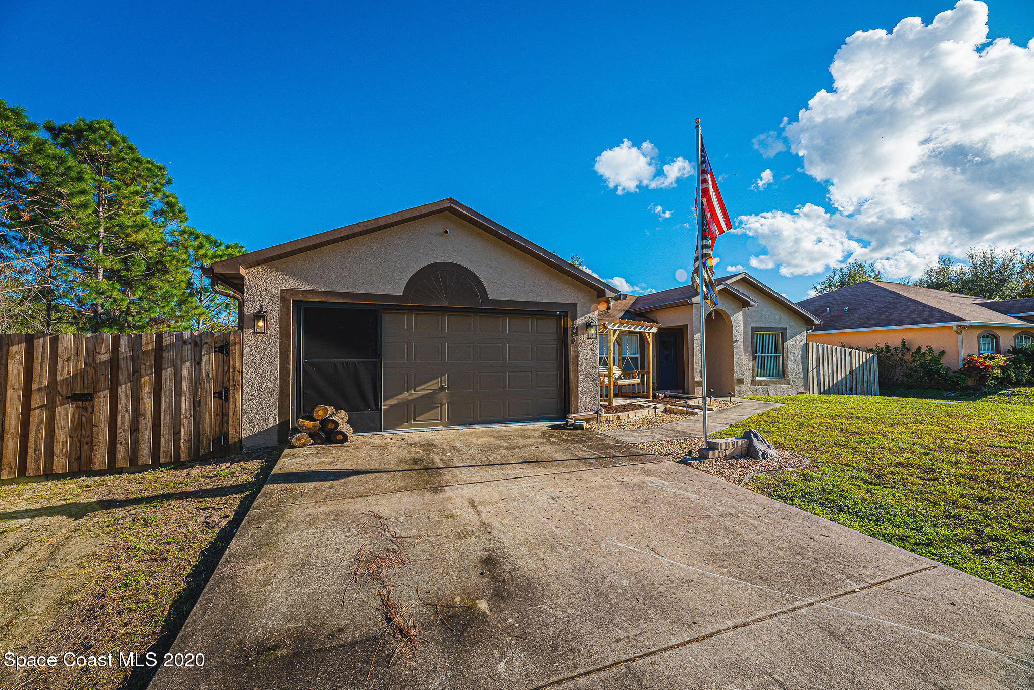 1240 Rabbit Street Southeast Palm Bay, FL 32909 - Photo 30 of 41 a front view of a house with a yard