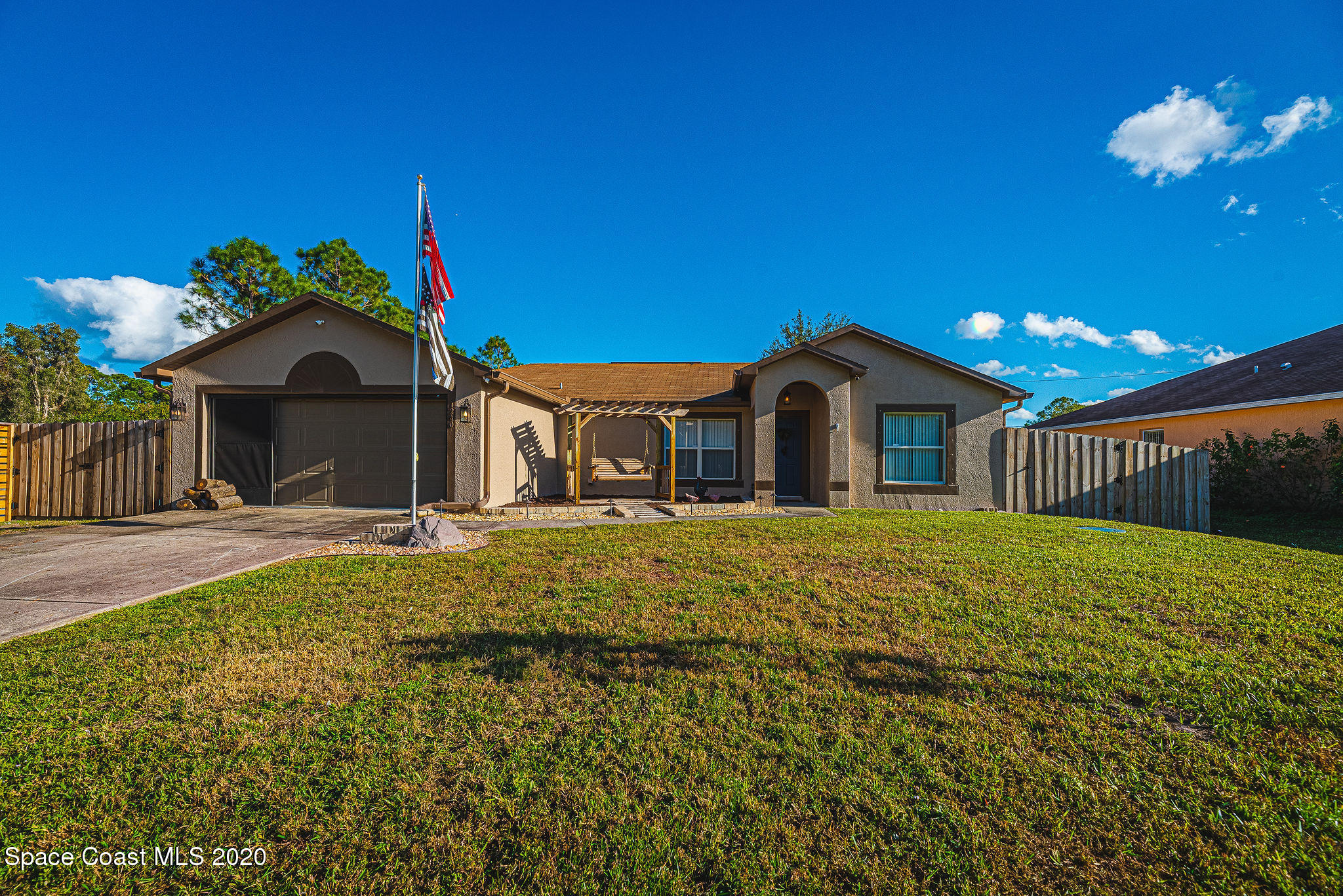 1240 Rabbit Street Southeast Palm Bay, FL 32909 - Photo 31 of 41 a view of a house with yard and garden