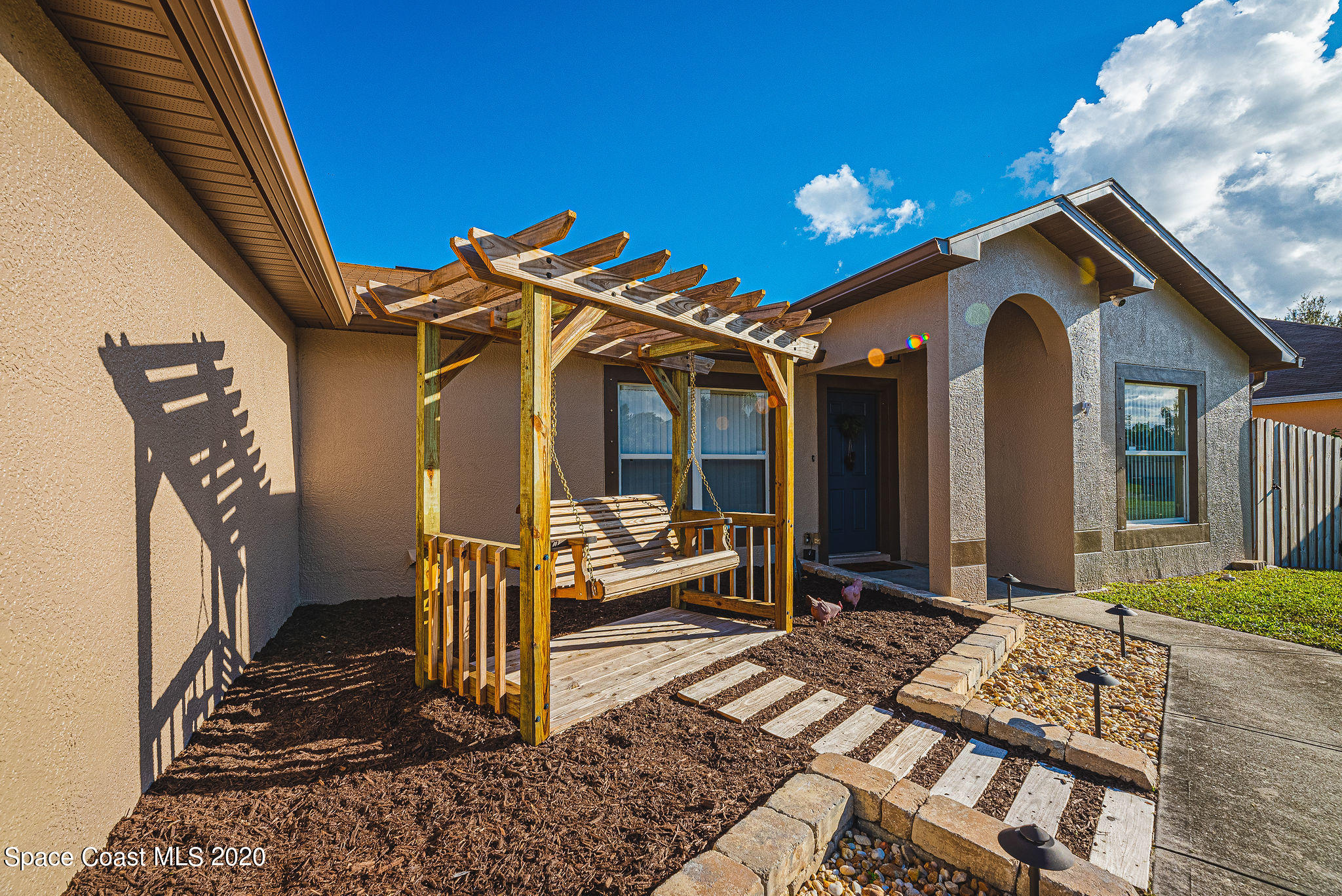 1240 Rabbit Street Southeast Palm Bay, FL 32909 - Photo 33 of 41 a view of a house with a porch