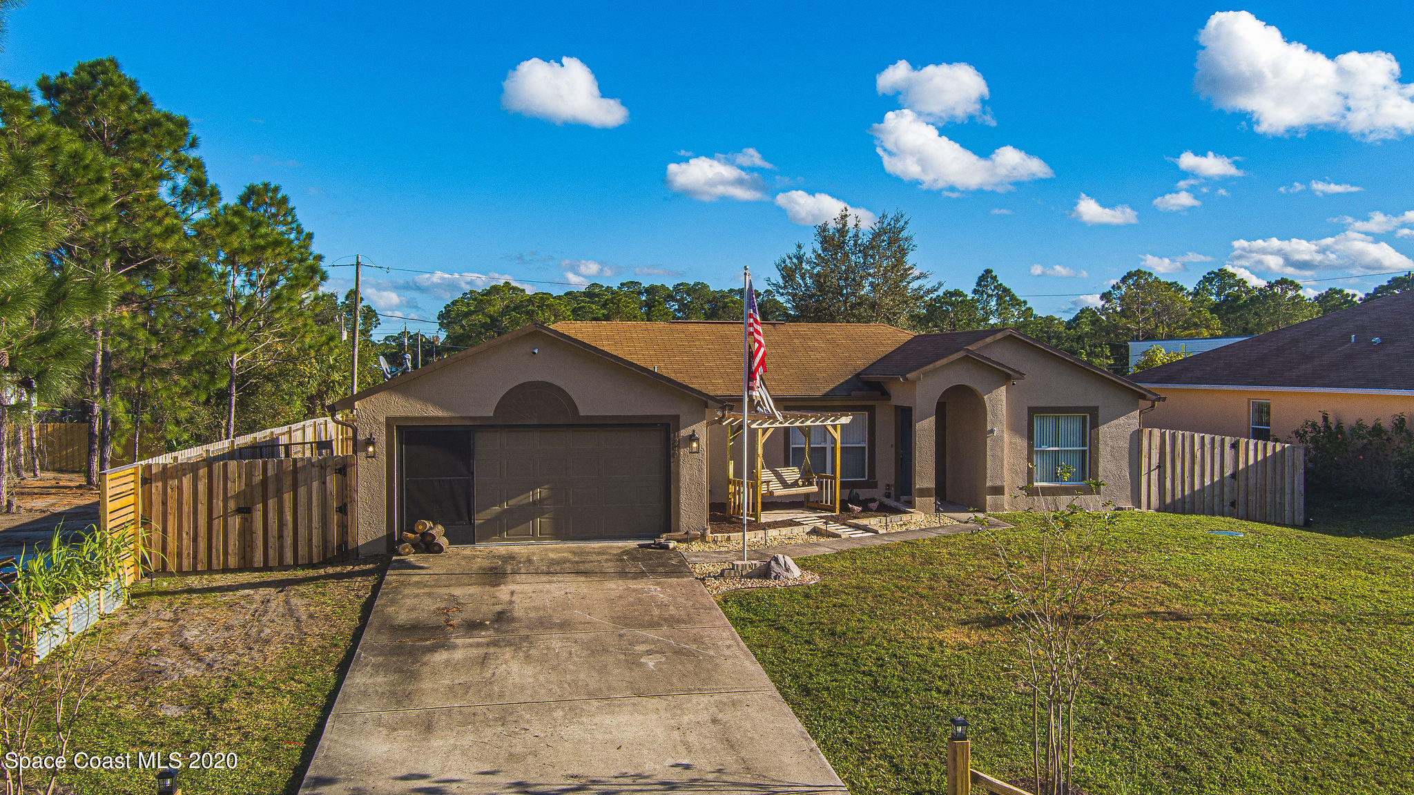 1240 Rabbit Street Southeast Palm Bay, FL 32909 - Photo 34 of 41 a front view of a house with a yard