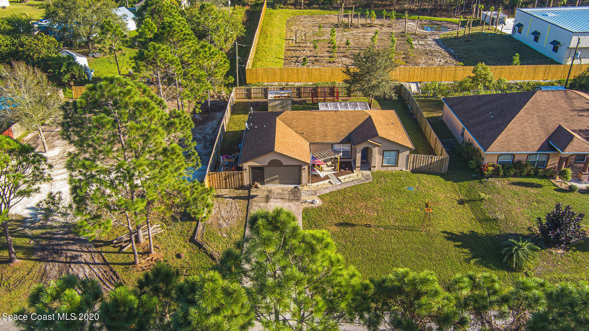 1240 Rabbit Street Southeast Palm Bay, FL 32909 - Photo 35 of 41 a swimming pool with outdoor seating and yard