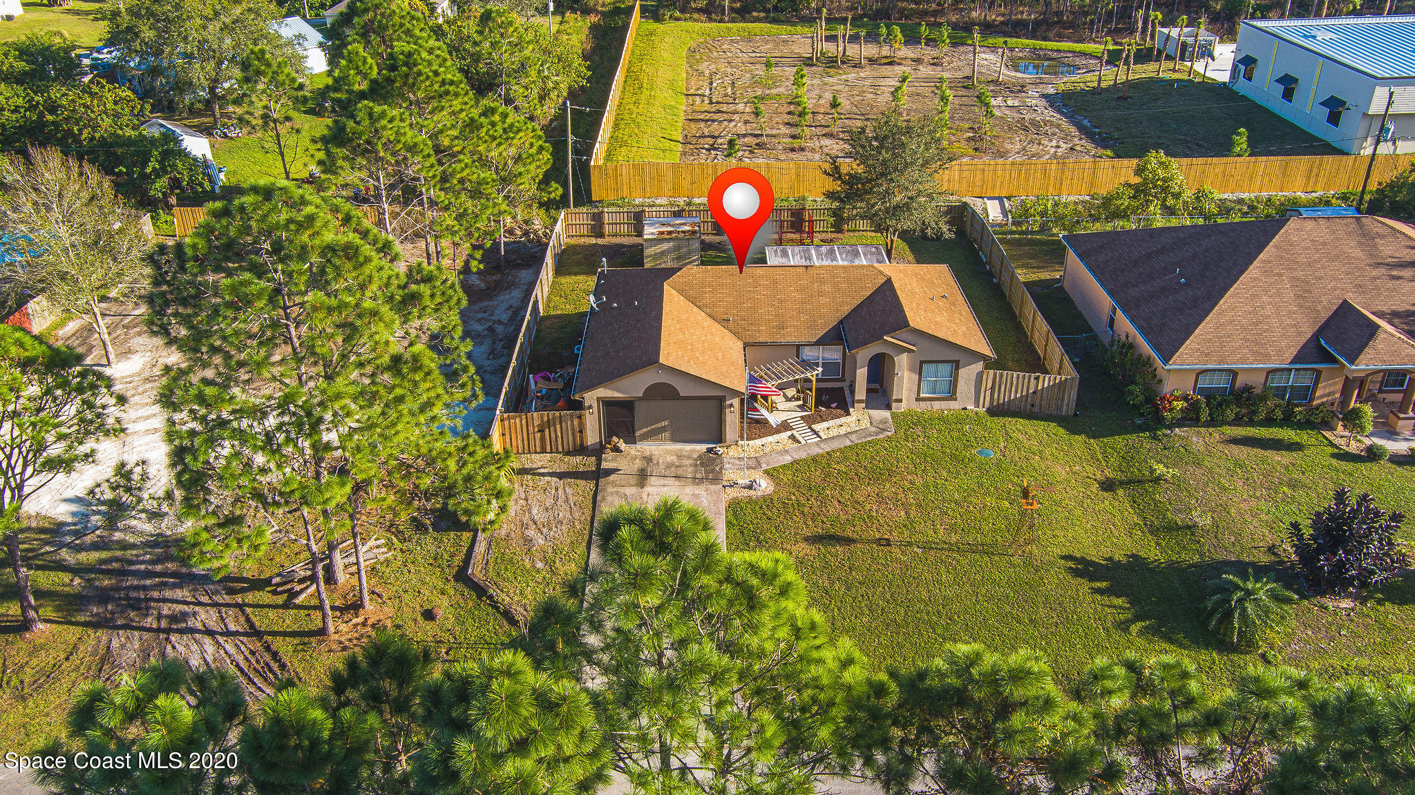 1240 Rabbit Street Southeast Palm Bay, FL 32909 - Photo 36 of 41 a aerial view of a house with swimming pool and patio