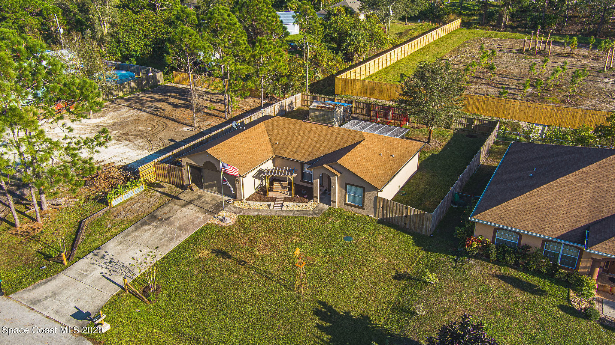 1240 Rabbit Street Southeast Palm Bay, FL 32909 - Photo 37 of 41 an aerial view of a house with swimming pool