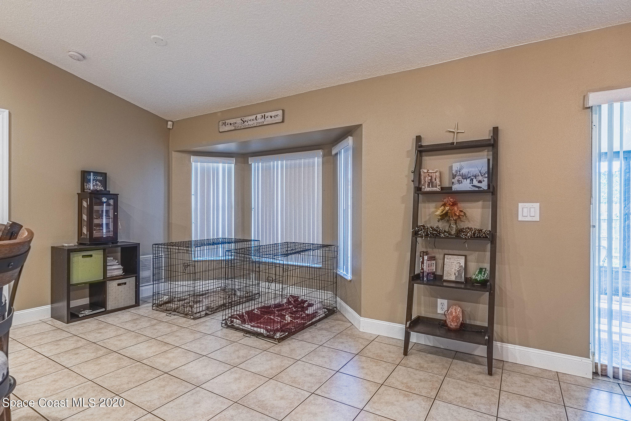 1240 Rabbit Street Southeast Palm Bay, FL 32909 - Photo 7 of 41 a living room with furniture and a rug