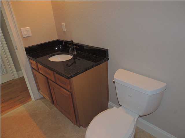 199 Walnut Street Santa Rosa Beach, FL 32459 - Photo 27 of 35 a bathroom with a toilet and a sink