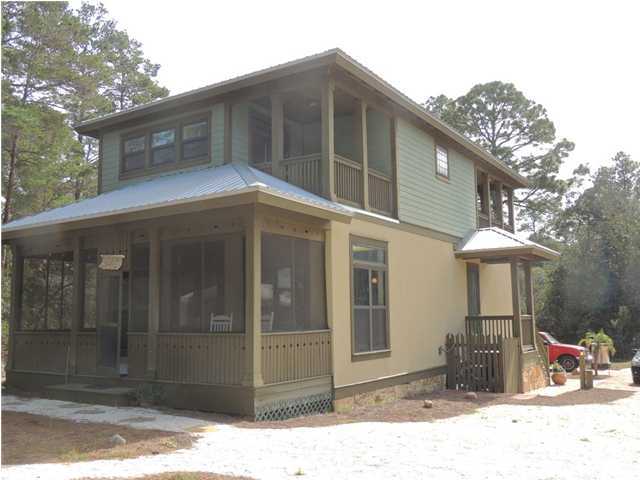 199 Walnut Street Santa Rosa Beach, FL 32459 - Photo 28 of 35 a backyard of a house with table and chairs