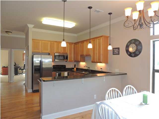 199 Walnut Street Santa Rosa Beach, FL 32459 - Photo 4 of 35 a kitchen with a table and chairs