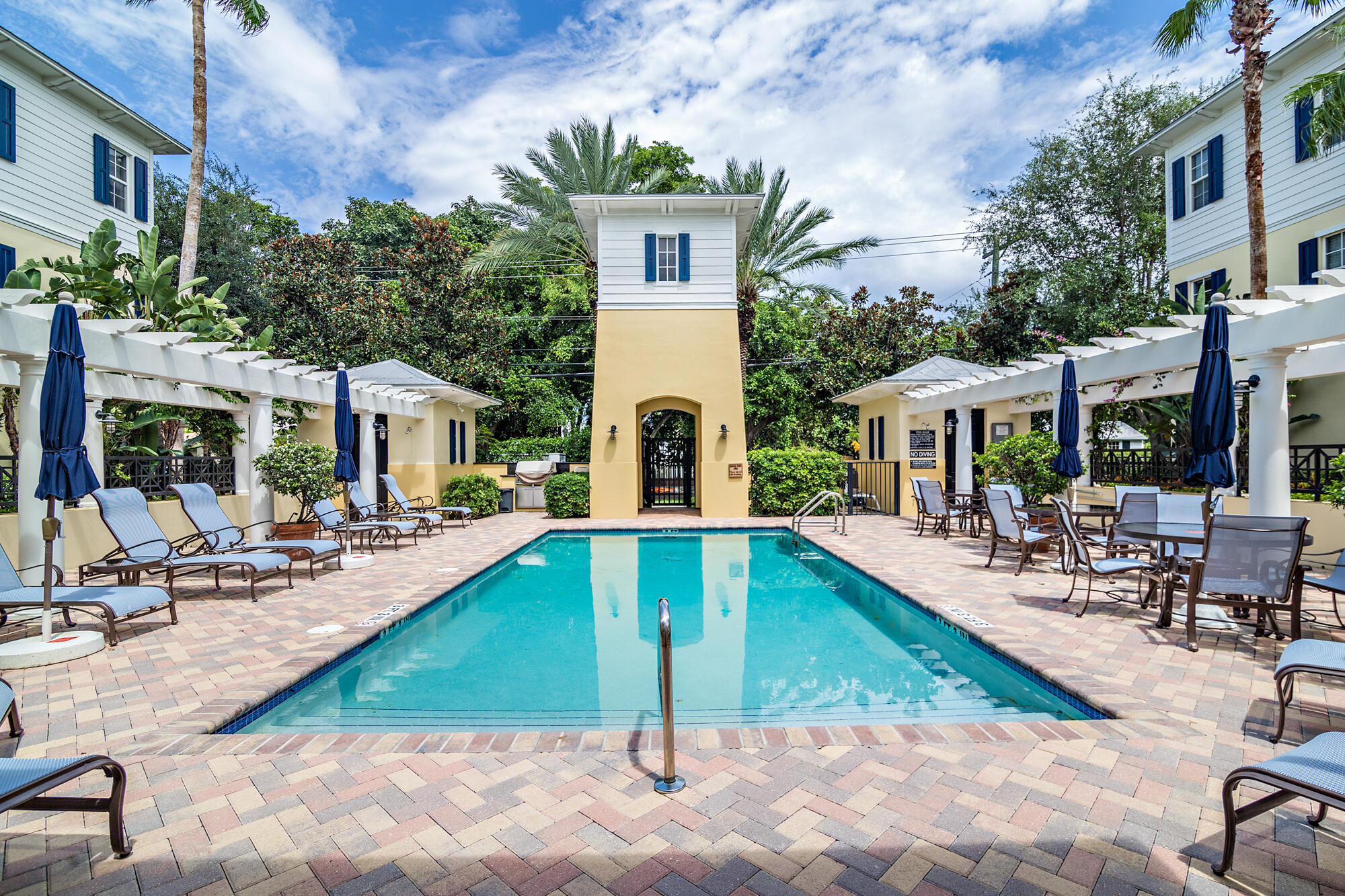 352 North Bromeliad West Palm Beach, FL 33401 - Photo 17 of 19 a view of a house with swimming pool and sitting area