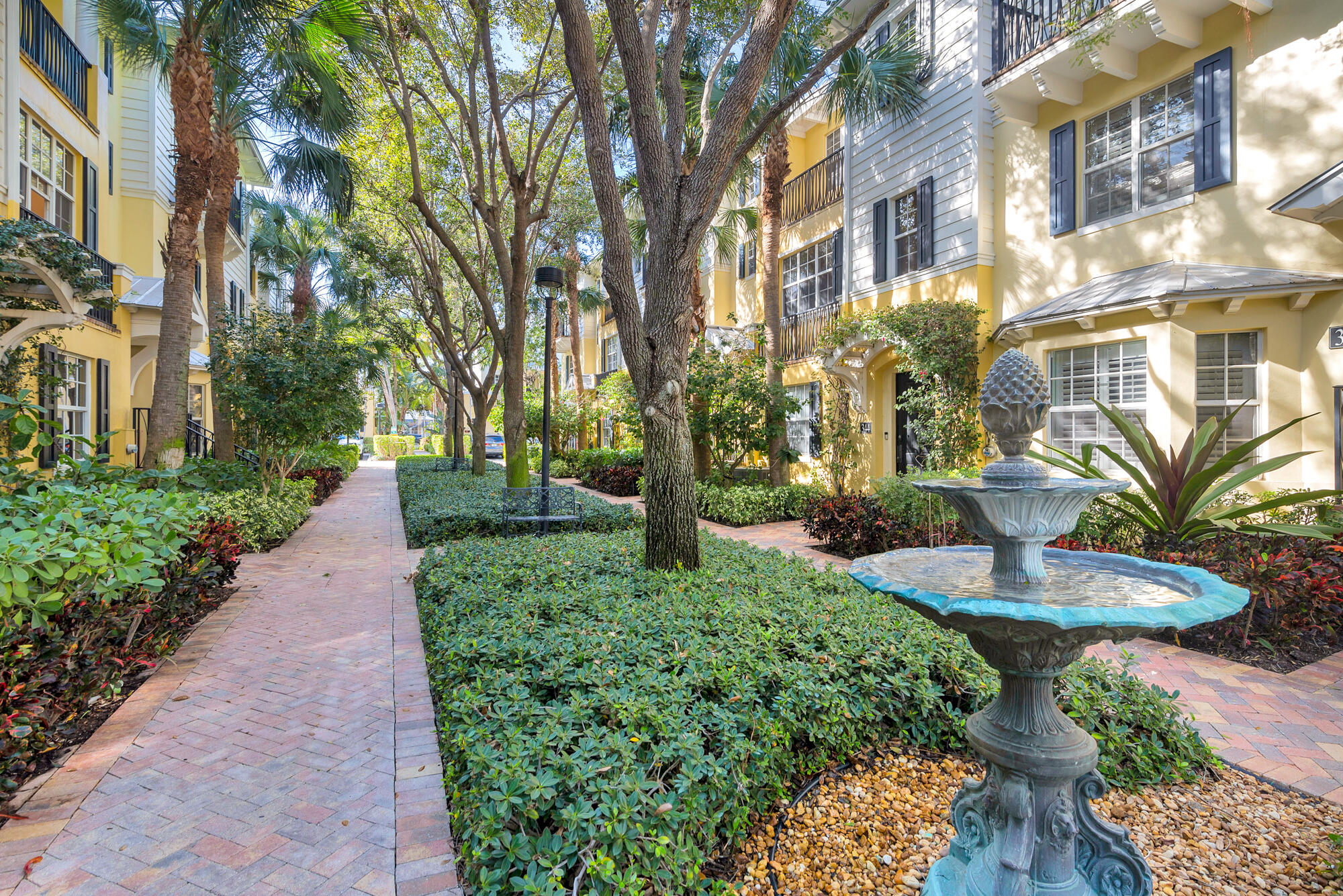 352 North Bromeliad West Palm Beach, FL 33401 - Photo 2 of 19 a view of a fountain in front of brick building
