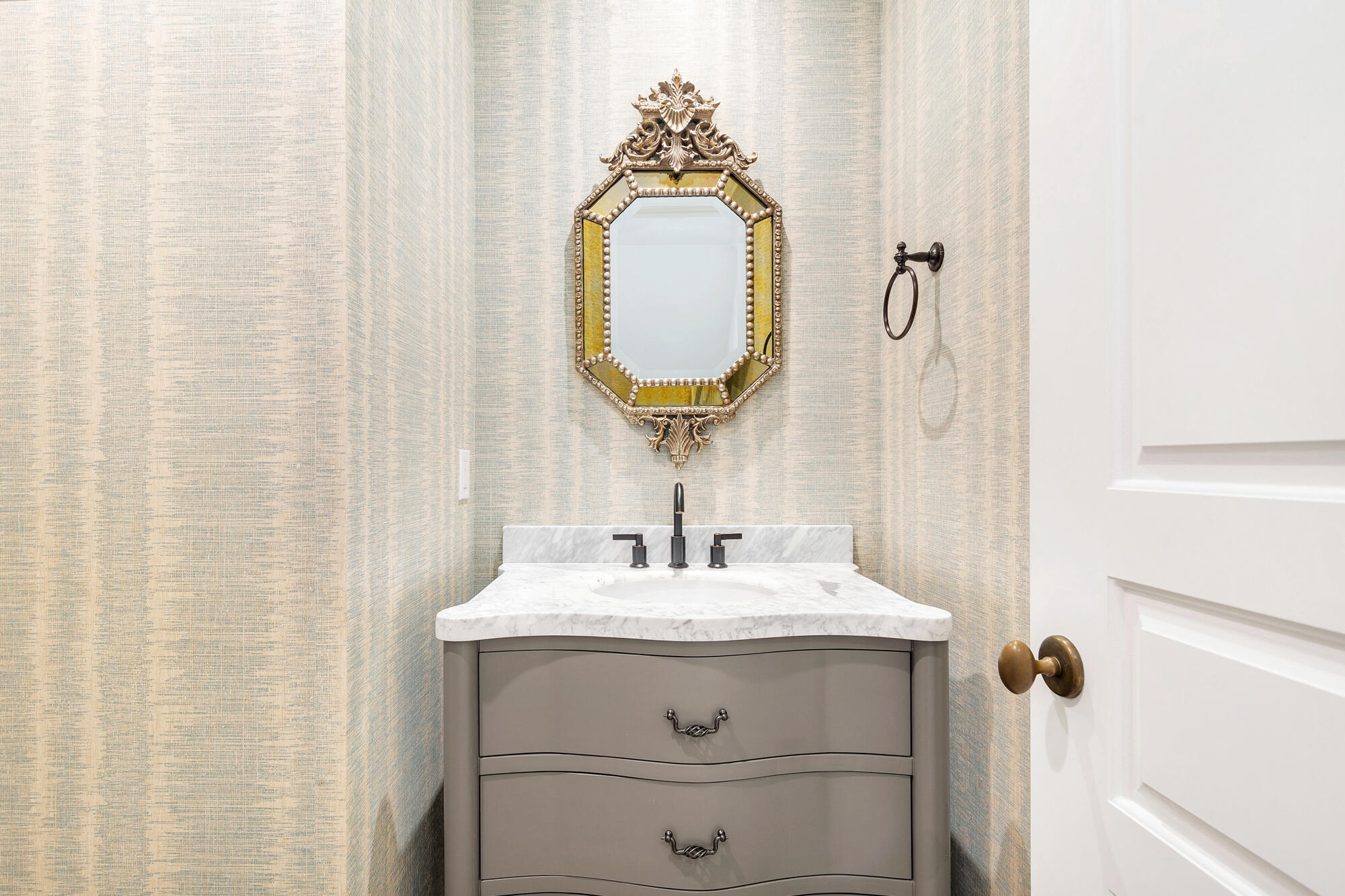 352 North Bromeliad West Palm Beach, FL 33401 - Photo 9 of 19 a bathroom with a sink and a mirror