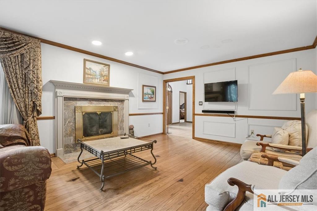 167 Federal Road Monroe Township, NJ 08831 - Photo 5 of 46 a living room with furniture a fireplace and a flat screen tv