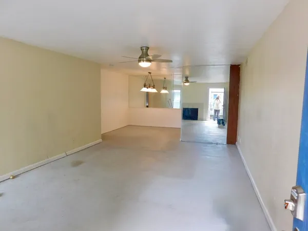 wooden floor in a room with a kitchen
