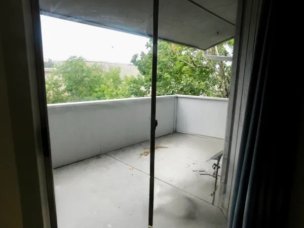 a view of a room with a floor to ceiling window
