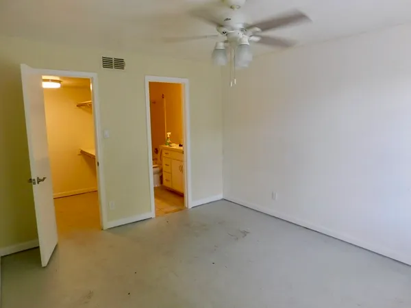 an empty room with a bathroom