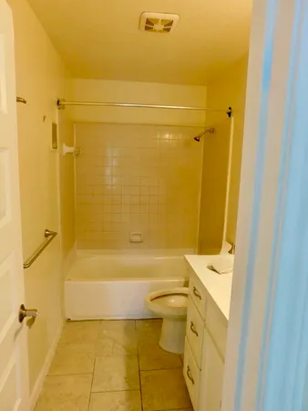 a bathroom with a toilet and a bathtub