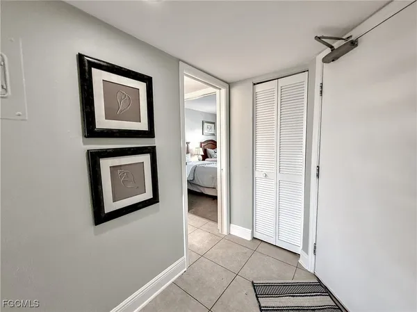 a en suite bathroom with a toilet sink and a mirror