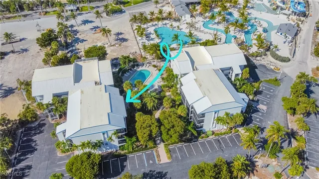 an aerial view of a house with a yard and garden
