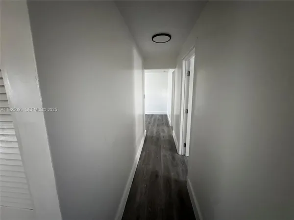 a view of a hallway with a glass door