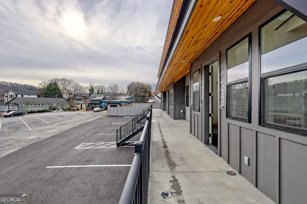 a bathroom with a shower and a sink