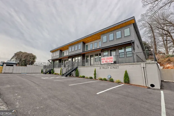 a front view of a house with large windows