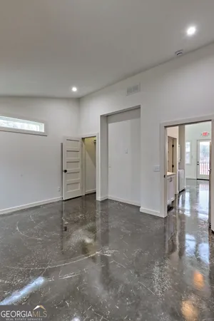 a view of balcony with wooden fence and large windows
