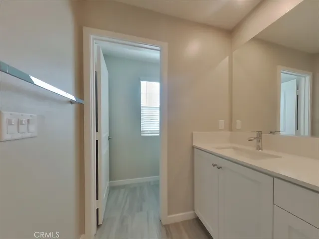 a en suite bathroom with a sink and mirror
