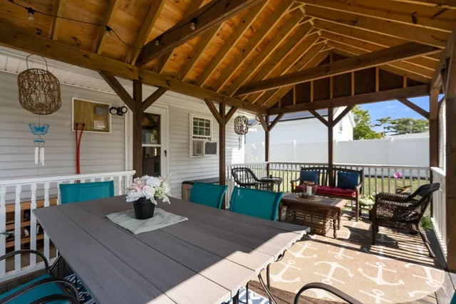 a view of a chairs and table in the patio
