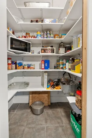 a room with storage and a white cabinets