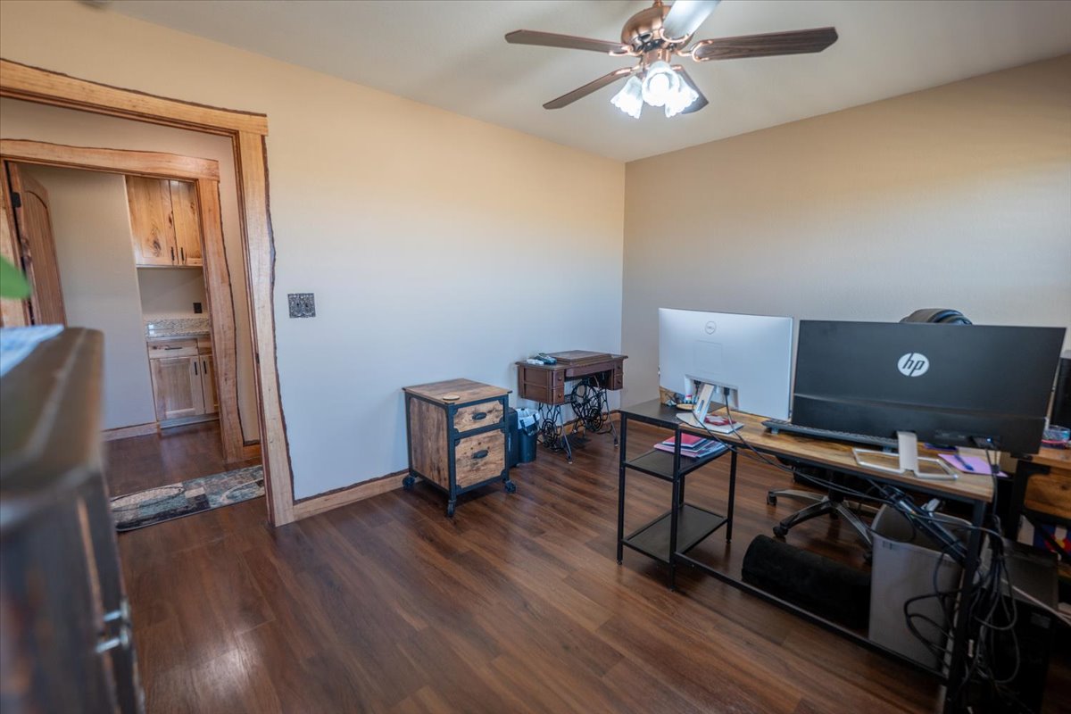 1825 Savanna Ridge Ranch Road Lometa, TX 76853 - Photo 23 of 35 Office area featuring dark wood-style floors and ceiling fan