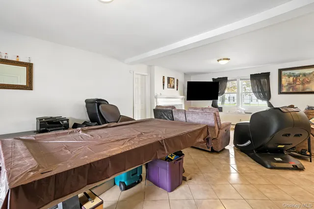 a bedroom with a bed and a chair