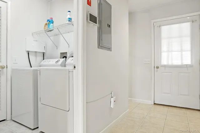 a utility room with closet and window