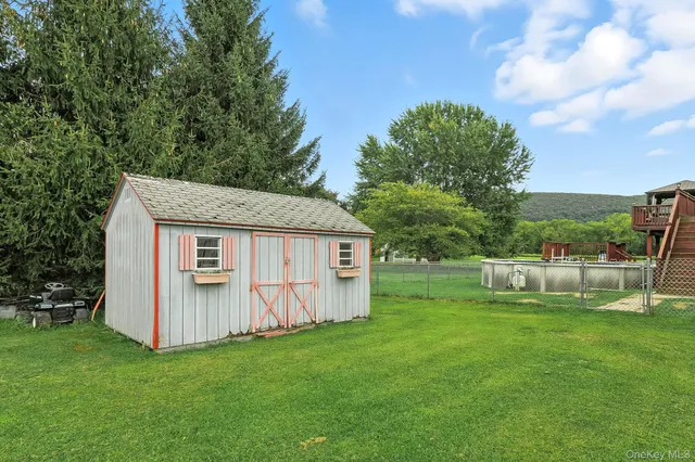 a view of a backyard with large tree