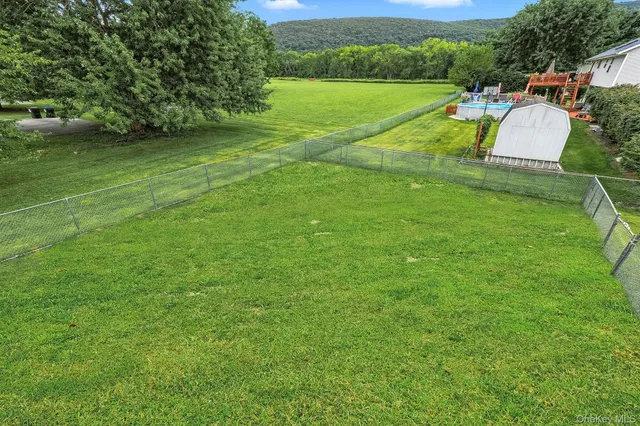 a view of a house with a big yard